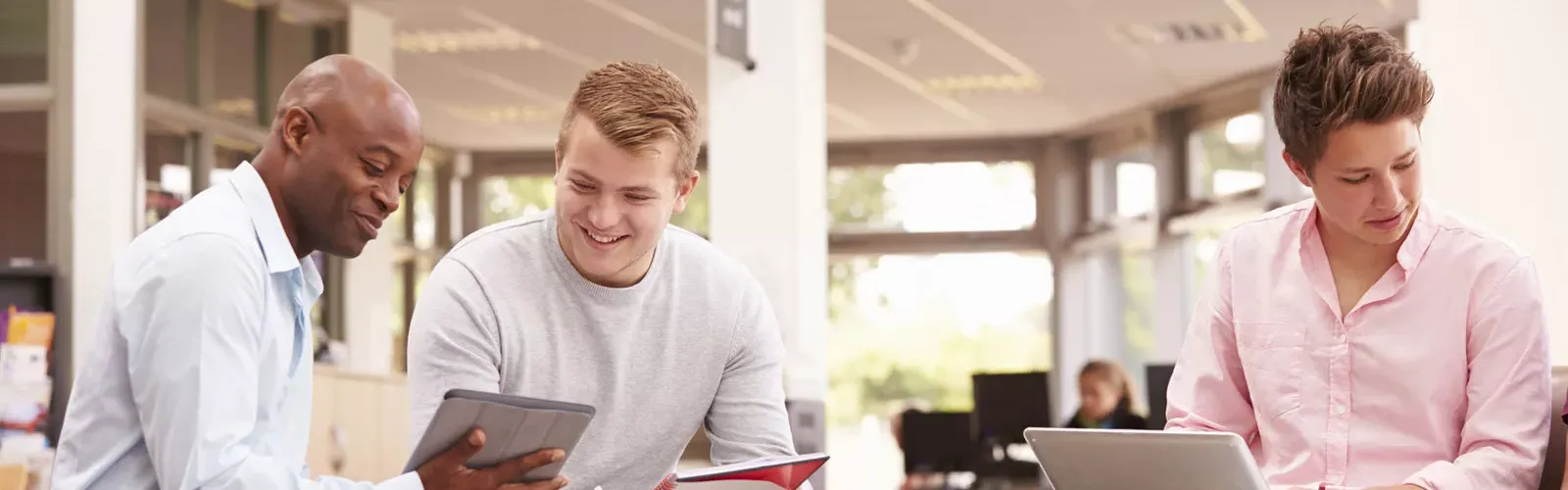 student being tutored in the library