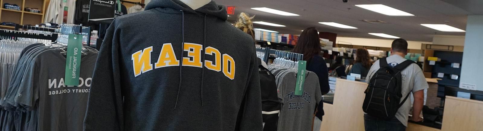 Campus bookstore, close up on a sweatshirt hanging on a rack