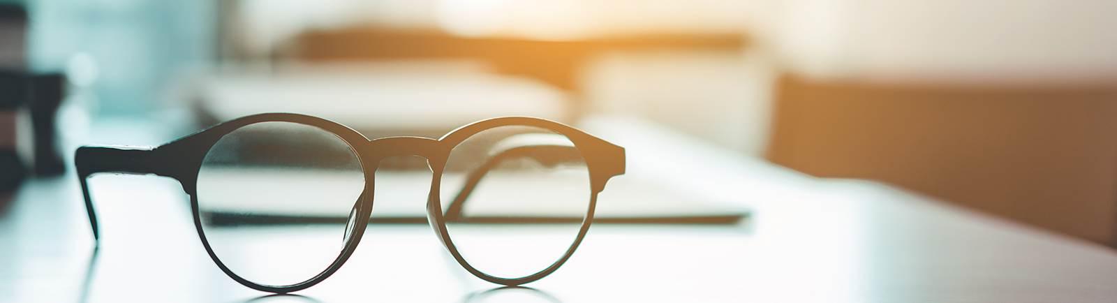 glasses sitting on a desk